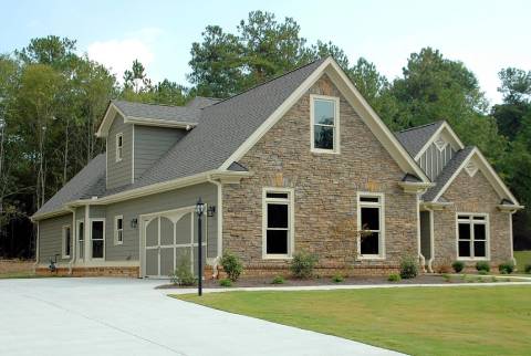 A house with brick and gray walls