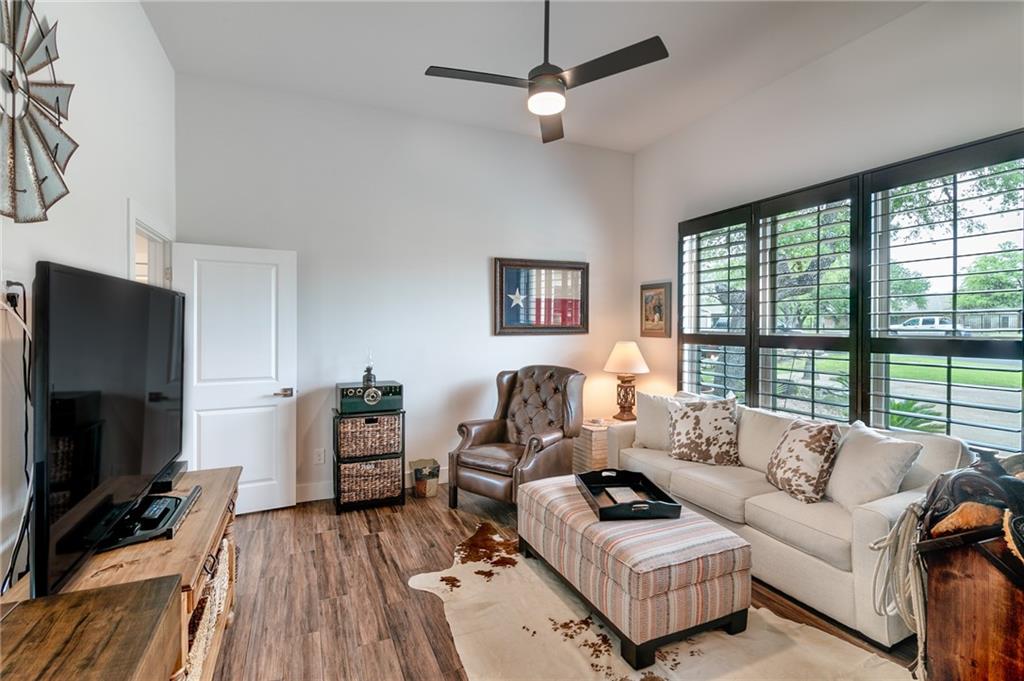 A living room with a sofa set and television