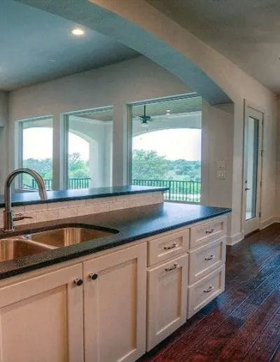 Kitchen sink with white cabinets