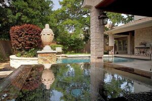 A swimming pool beside the garden