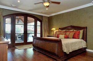 A bedroom with glass door